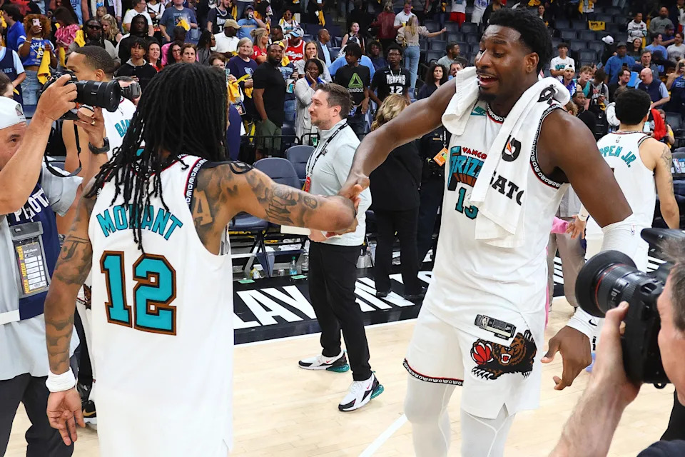 Apr 18, 2025; Memphis, Tennessee, USA; Memphis Grizzlies guard Ja Morant (12) and forward Jaren Jackson Jr. (13) react after defeating the Dallas Mavericks at FedExForum. Mandatory Credit: Petre Thomas-Imagn Images