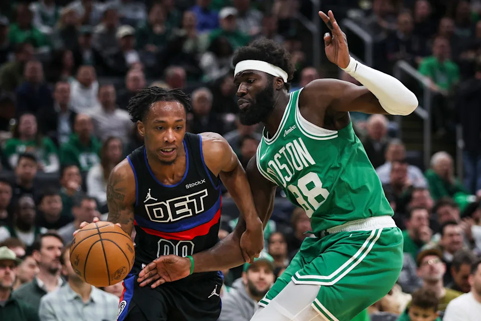 BOSTON, MA - DECEMBER 12: Ronald Holland II #00 of the Detroit Pistons goes to the basket past Neemias Queta #88 of the Boston Celtics during the first half of a game at TD Garden on December 12, 2024 in Boston, Massachusetts. NOTE TO USER: User expressly acknowledges and agrees that, by downloading and or using this photograph, User is consenting to the terms and conditions of the Getty Images License Agreement. (Photo by Adam Glanzman/Getty Images)