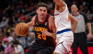 FILE - Atlanta Hawks forward Georges Niang, left, drives the ball down court against New York Knicks guard Landry Shamet, during the second half of an NBA basketball game, April 5, 2025, in Atlanta. (AP Photo/Erik Rank, File)