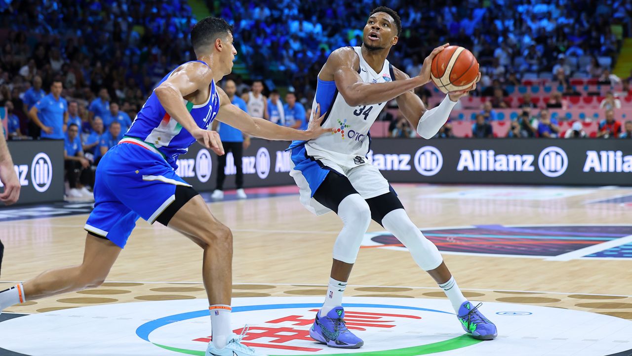 Italy's' Simone Fontecchio defends against Greece's Giannis Antetokounmpo during the Eurobasket, European Basketball Championship Group C match between Greece and Italy at the Spyros Kyprianou Arena in Limassol, Cyprus, Thursday, Aug. 28, 2025. (AP Photo/Chara Savvidou)