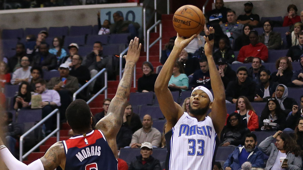Dec 23, 2017; Washington, DC, USA; Orlando Magic forward Adreian Payne (33) shoots the ball over Washington Wizards forward Markieff Morris (5) in the first quarter at Capital One Arena.