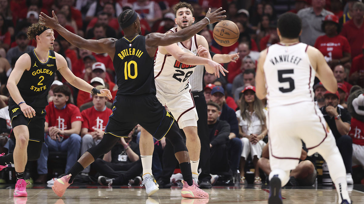 Houston Rockets center Alperen Sengun (28) passes the ball to guard Fred VanVleet (5) during the second quarter of game seven of first round for the 2025 NBA Playoffs against the Golden State Warriors at Toyota Center.