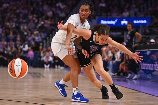 Atlanta Dream's Te-Hina Paopao (2) guards Golden State Valkyries' Carla Leite (0) while chasing down a loose ball in the second quarter of their WNBA game at Chase Center in San Francisco, Calif., on Sunday, Aug. 17, 2025. (Jose Carlos Fajardo/Bay Area News Group)