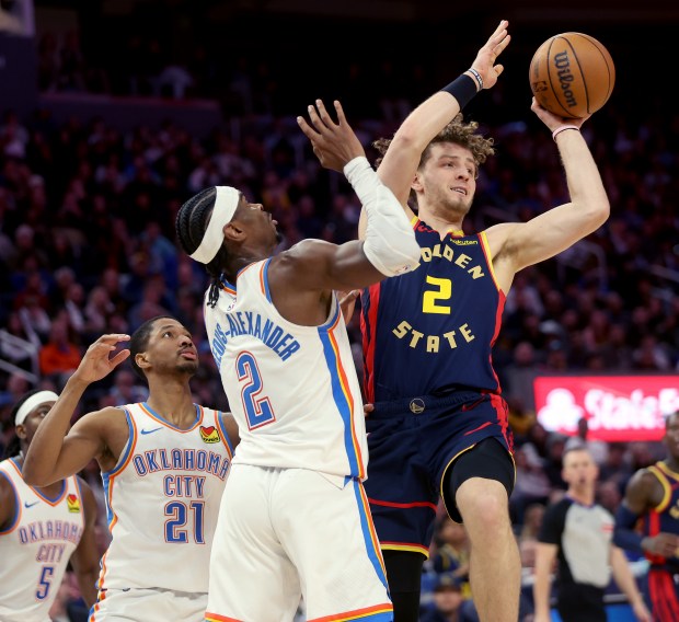 Golden State Warriors' Brandin Podziemski #2 passes as he's pressured by Oklahoma City Thunder's Shai Gilgeous-Alexander #2 in the third quarter of their NBA game at the Chase Center in San Francisco, Calif., on Wednesday, Jan. 29, 2025. (Jane Tyska/Bay Area News Group)
