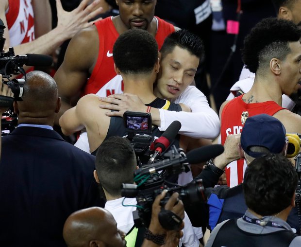 OAKLAND, CA - JUNE 13: Golden State Warriors' Stephen Curry (30) hugs Toronto Raptors' Jeremy Lin (17) following the Raptors 114-110 win in Game 6 of the NBA Finals at Oracle Arena in Oakland, Calif., on Thursday, June 13, 2019. (Nhat V. Meyer/Bay Area News Group)