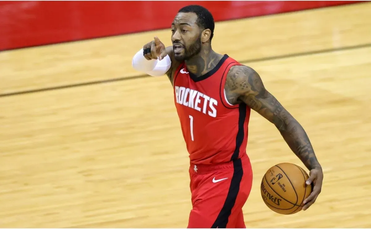 John Wall says he plans to work out at Kentucky