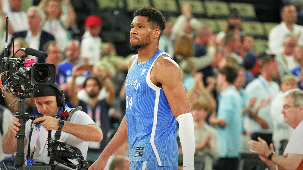 Greece small forward Giannis Antetokounmpo (34) reacts after their loss against Germany during a menís basketball quarterfinal game during the Paris 2024 Olympic Summer Games at Accor Arena with Greece men's basketball coach Vassilis Spanoulis