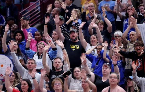 Fans cheer for a T-shirt during a second-half break in the Sky-Fever game June 7, 2025, at the United Center. (Chris Sweda/Chicago Tribune)