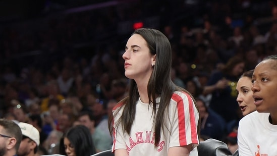 Caitlin Clark #22 of the Indiana Fever watches from the bench during the first half of the WNBA game against the Phoenix Mercury (Getty Images via AFP)