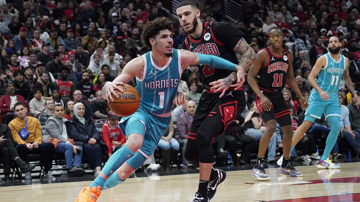 Cavs guard Lonzo Ball (2) defends Charlotte Hornets guard LaMelo Ball (1) during the second half at United Center with LaMelo Ball in the background