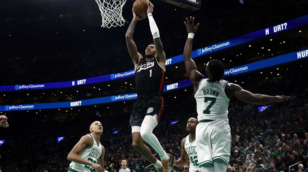 Portland Trail Blazers guard Anfernee Simons (1) goes to the basket past Boston Celtics guard Jaylen Brown (7) during the second half at TD Garden.