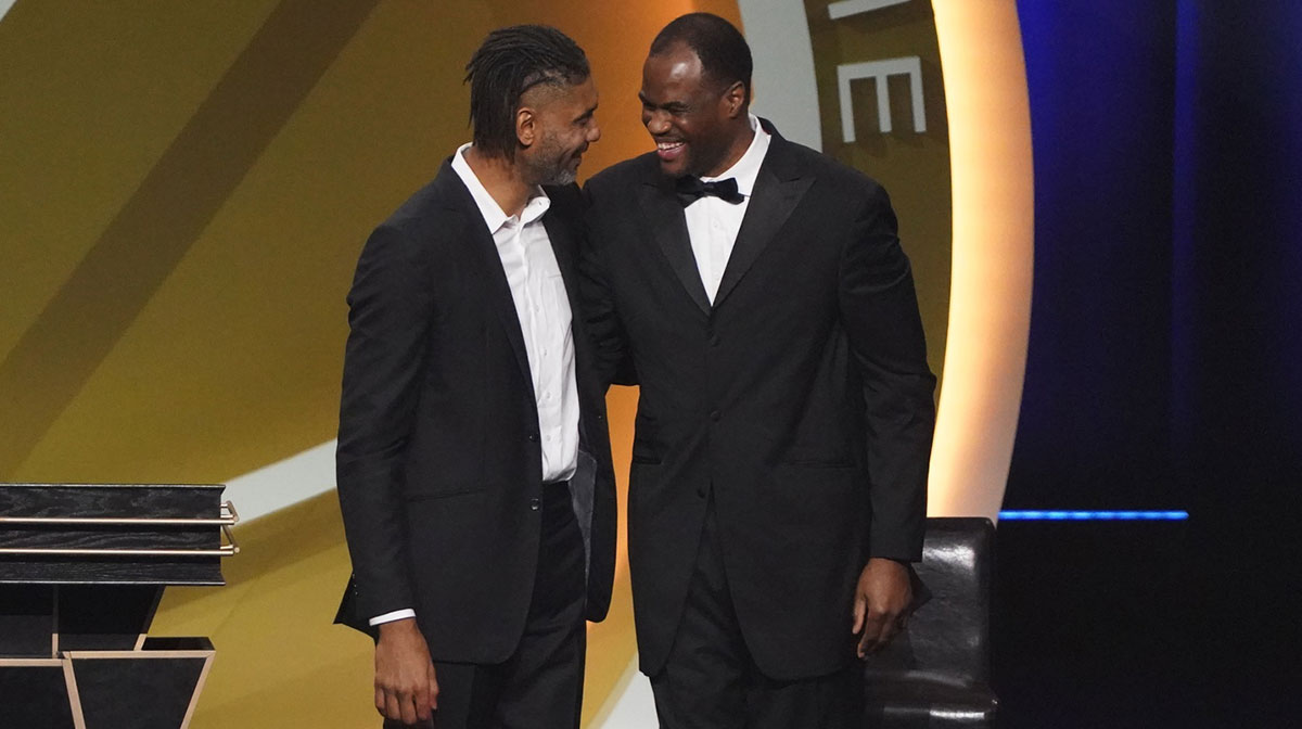 Class of 2020 inductee Tim Duncan (left) with presenter David Robinson (right) during the Naismith Memorial Basketball Hall of Fame Enshrinement ceremony at Mohegan Sun Arena.