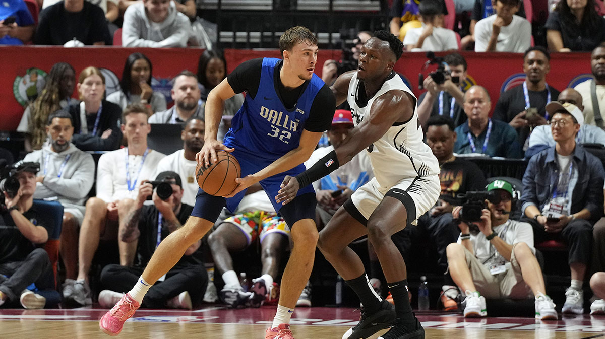 San Antonio Spurs forward Osayi Osifo (26) defends against Dallas Mavericks forward Cooper Flagg (32) in the second quarter of their game at Thomas & Mack Center.
