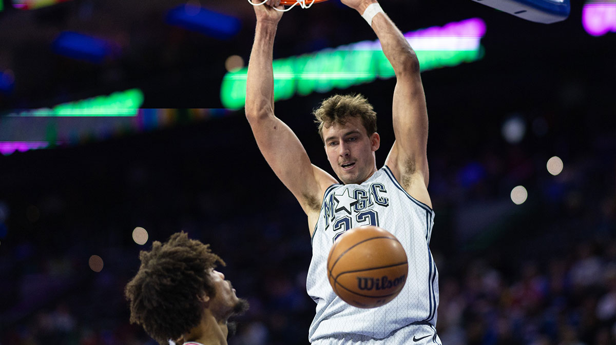 Orlando Magic forward Franz Wagner (22) dunks the ball in front of Philadelphia 76ers guard Kelly Oubre Jr. (9) during the first quarter at Wells Fargo Center.