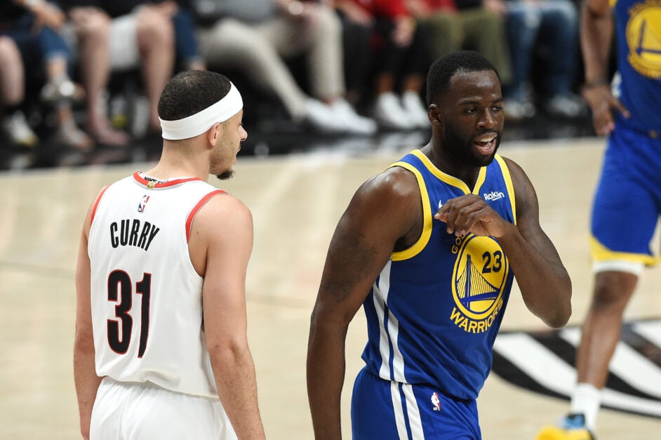 Draymond Green #23 of the Golden State Warriors talks to Seth Curry #31 of the Portland Trail Blazers in game three of the NBA Western Conference Finals at Moda Center on May 18, 2019 in Portland, Oregon.