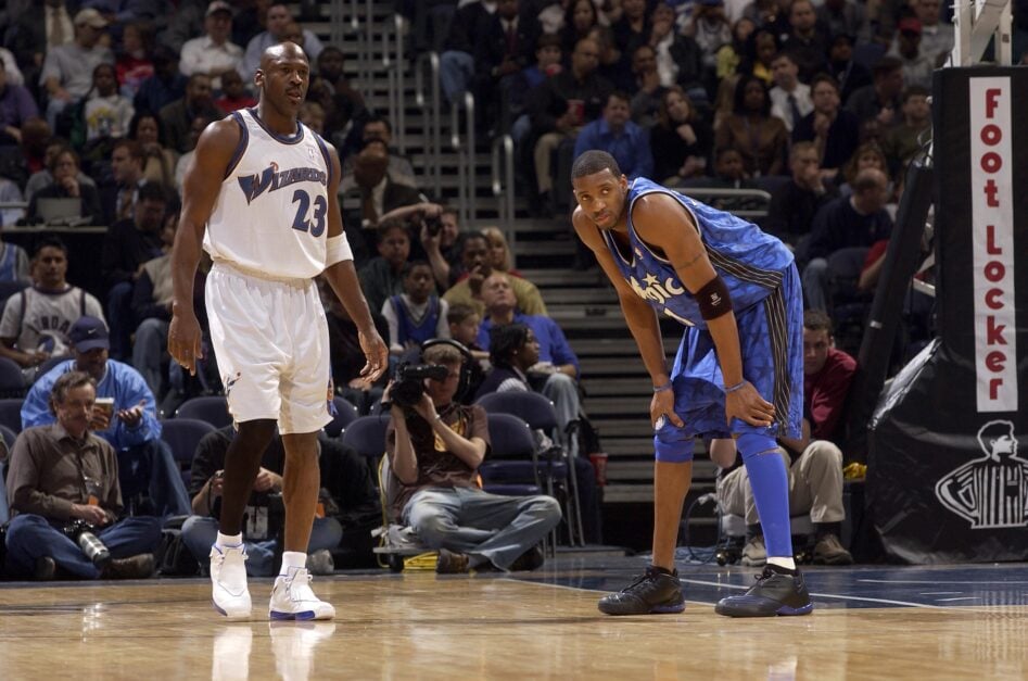 Tracy McGrady #1 of the Orlando Magic plays against Michael Jordan #23 of the Washington Wizards on March 11, 2003 at the MCI Center.