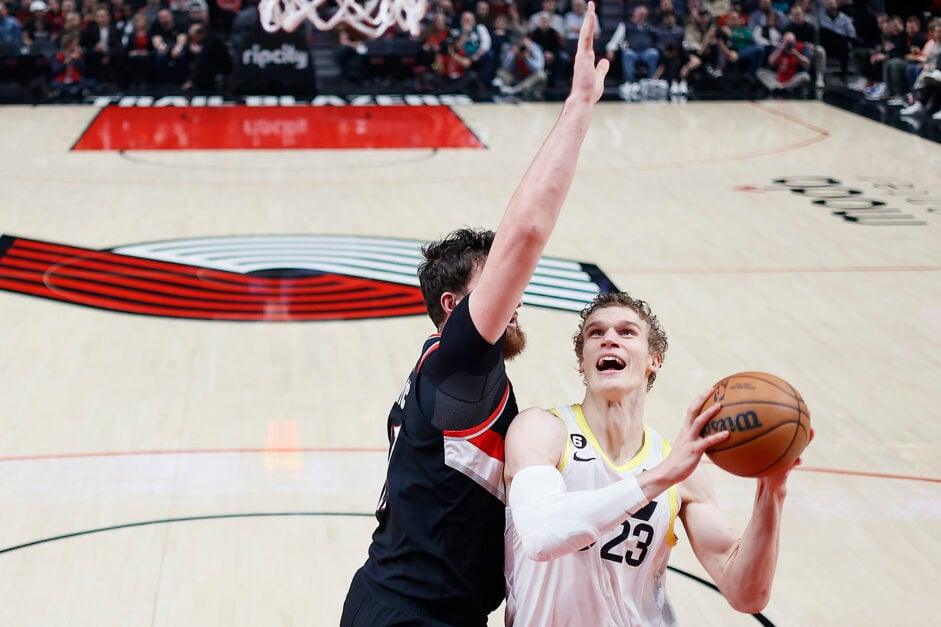 Lauri Markkanen #23 of the Utah Jazz shoots the ball against Jusuf Nurkic #27 (L) of the Portland Trail Blazers during the second half at Moda Center on January 25, 2023 in Portland, Oregon.