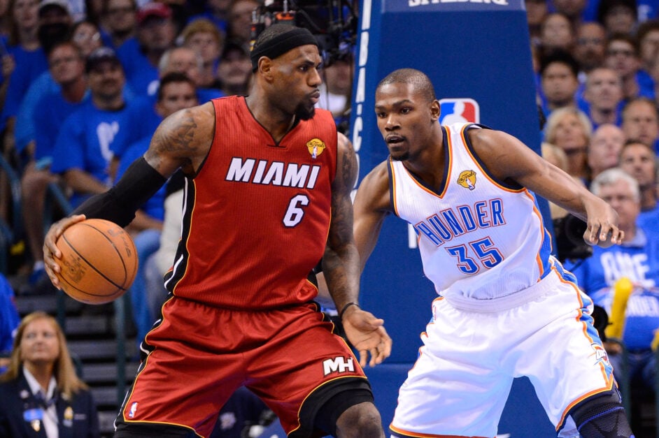 LeBron James #6 of the Miami Heat posts up Kevin Durant #35 of the Oklahoma City Thunder