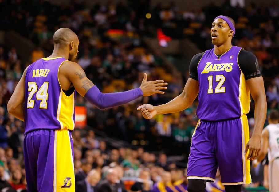 Los Angeles Lakers guard Kobe Bryant shakes hands with center Dwight Howard