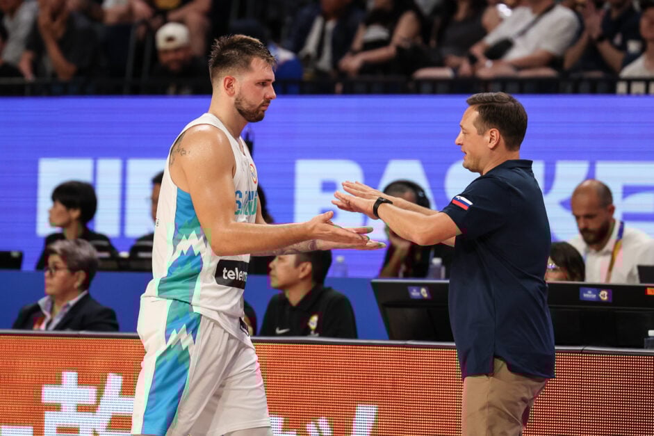 Luka Doncic slaps hands with Slovenia coach Aleksander Sekulic