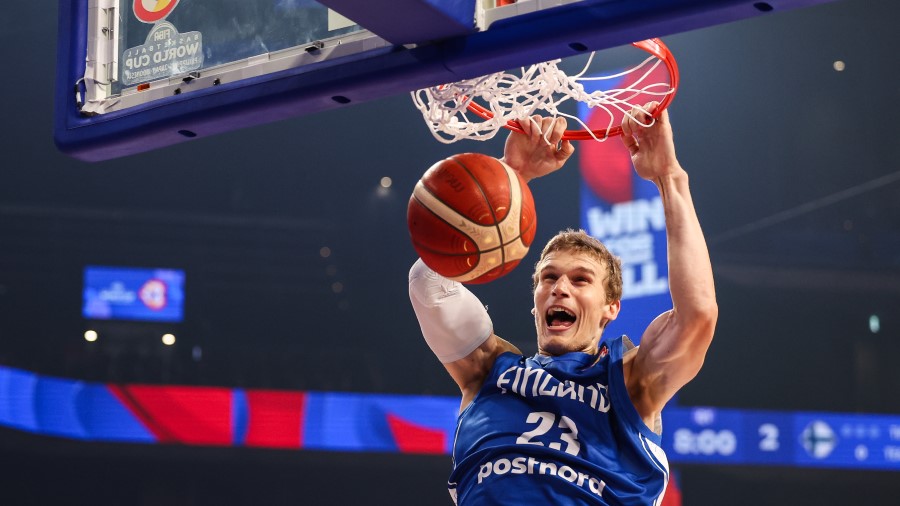 Lauri Markkanen #23 of Finland dunks the ball