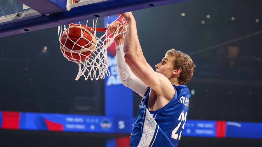 Lauri Markkanen #23 of Finland dunks the ball