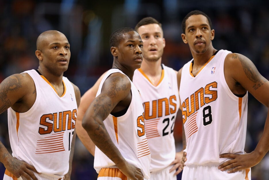 P.J. Tucker #17, Archie Goodwin #20, Miles Plumlee #22 and Channing Frye #8 of the Phoenix Suns look down court during a time out from the NBA game against the Utah Jazz at US Airways Center on November 1, 2013 in Phoenix, Arizona.
