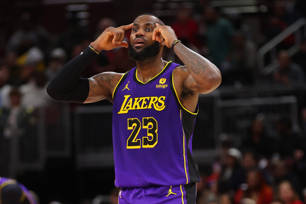 LeBron James #23 of the Los Angeles Lakers puts both index fingers on his head.
