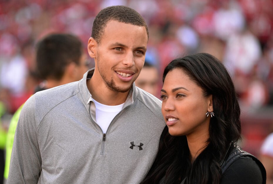 Golden State Warriors guard Stephen Curry and his wife Ayesha are fans on the sidelines during the Carolina Panthers and San Francisco 49ers NFL Game.