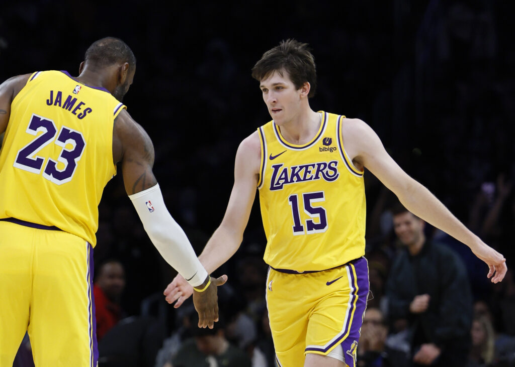 Lakers forward LeBron James, #23, left, congratulates Lakers guard Austin Reaves, #15