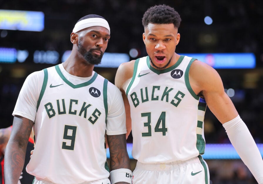 Bobby Portis #9 of the Milwaukee Bucks and Giannis Antetokounmpo #34 of the Milwaukee Bucks chat during the second half against the Chicago Bulls at United Center.