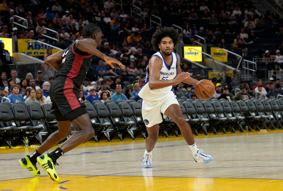Ethan Thompson #55 of the Golden State Warriors drives on Gabe Brown #44 of the Miami Heat during the second half of a 2024 California Classic summer league game at Chase Center on July 06, 2024 in San Francisco, California.