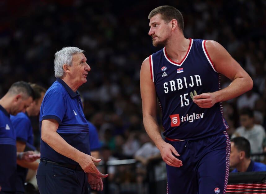 head coach Svetislav Pesic (L) of Serbia speaks to Nikola Jokic (R).