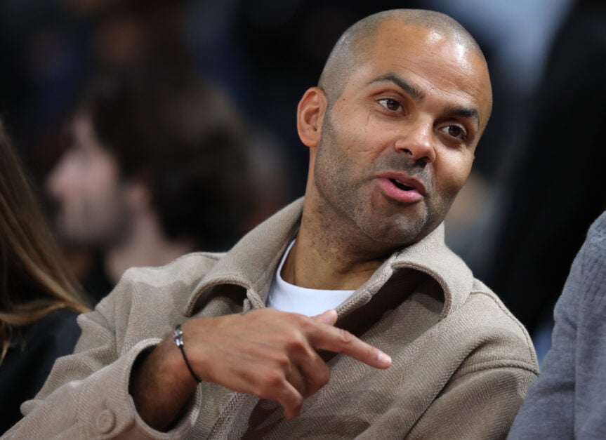 Tony Parker watching a San Antonio Spurs from the sidelines.