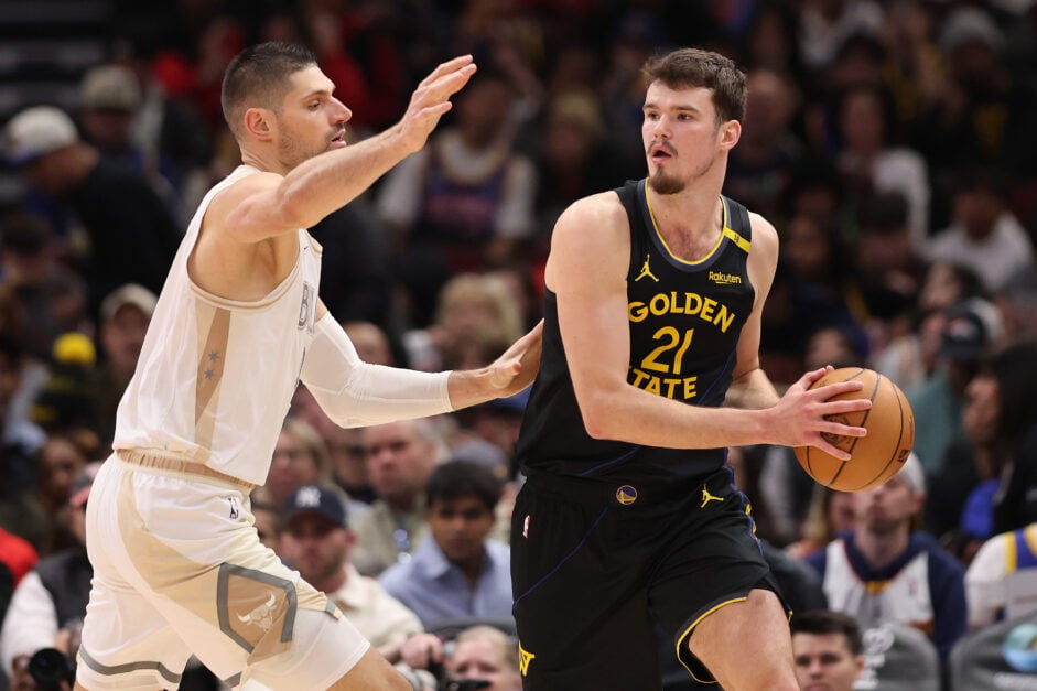 Golden State Warriors center Quentin Post handles the ball against Chicago Bulls center Nikola Vucevic