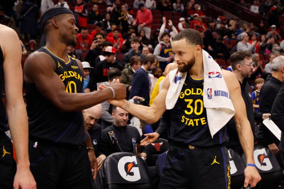 Jimmy Butler #10 and Stephen Curry #30 of the Golden State Warriors celebrate