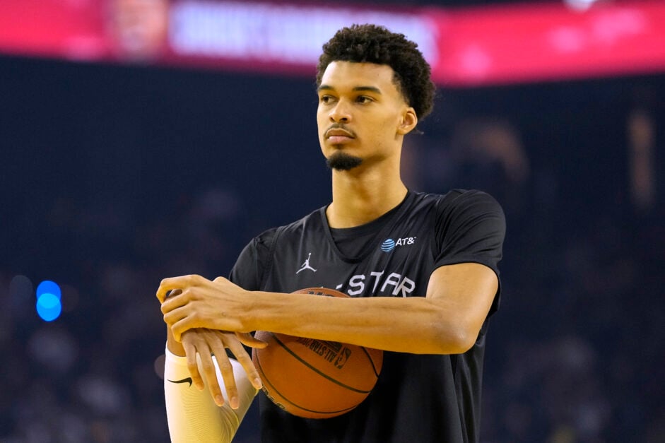 Victor Wembanyama #1 of the San Antonio Spurs and Chuck's Global Stars looks on during 2025 NBA All-Star Practice and Media Availability at Oakland Arena.