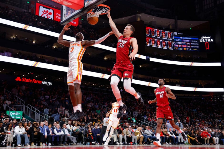 Duncan Robinson and Caris LeVert in an NBA game last season