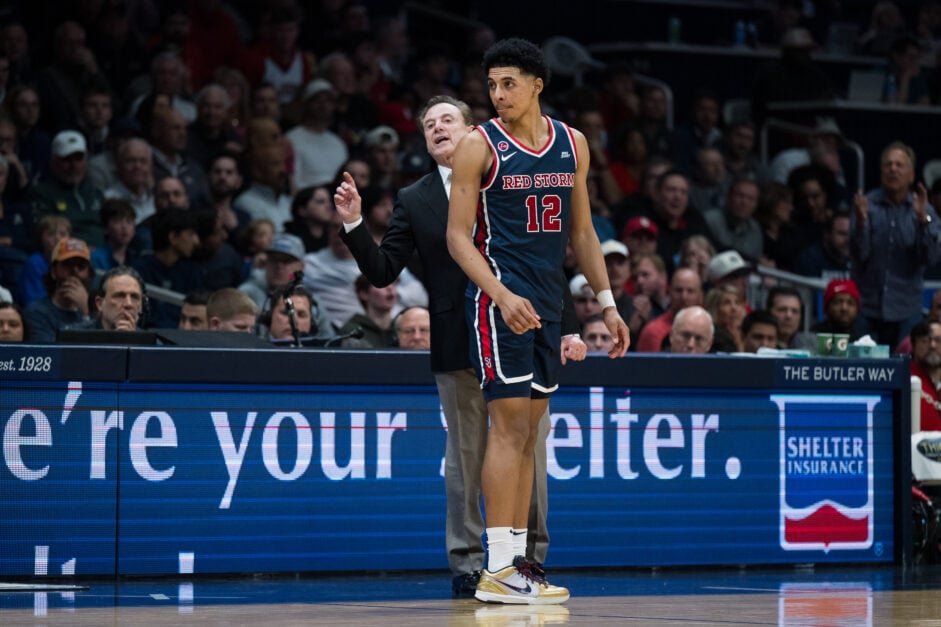 RJ Luis Jr on the edge of the court for St Johns. Rick Pitino background