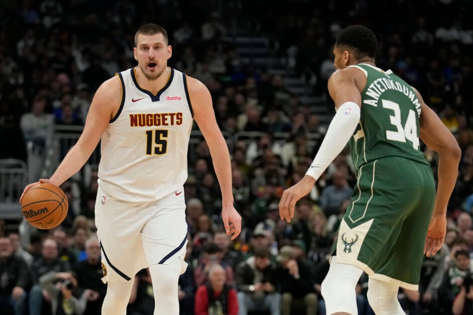 Denver Nuggets superstar Nikola Jokic playing against fellow superstar Giannis Antetokounmpo of the Milwaukee Bucks.
