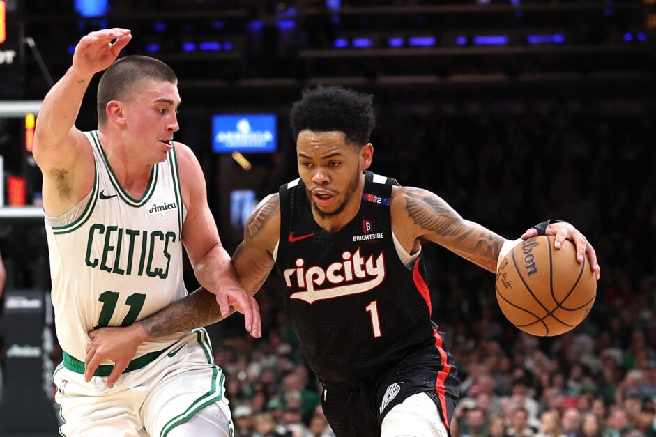 Portland Trail Blazers guard Anfernee Simons dribbles against Boston Celtics guard Payton Pritchard
