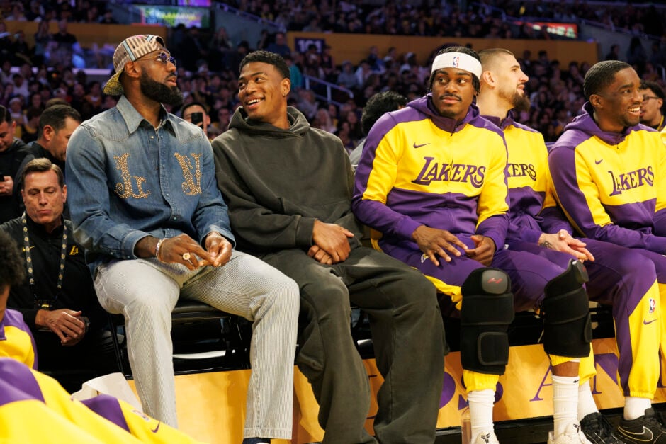 Injured Los Angeles Lakers forward LeBron James joins his teammates on the bench during the game against the Phoenix Suns at Crypto.com Arena on March 16, 2025 in Los Angeles, California. Injured Los Angeles Lakers forward Rui Hachimura is on the right.