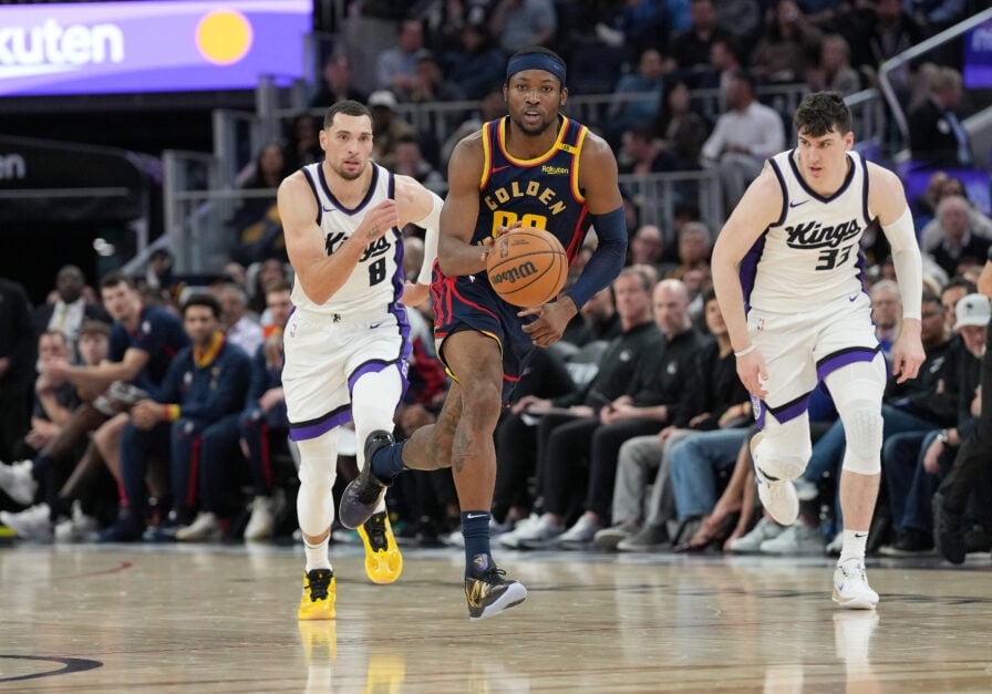 Golden State Warriors forward Jonathan Kuminga dribbles against the Sacramento Kings