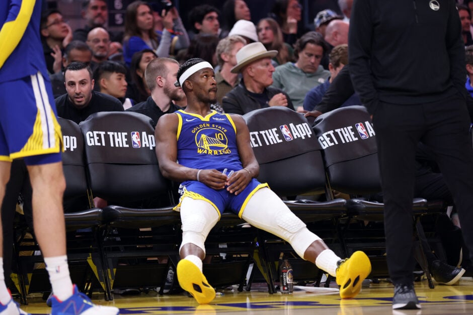 Golden State Warriors forward Jimmy Butler sits on the bench against the Denver Nuggets