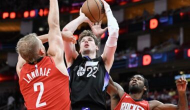 Tari Eason #17 of the Houston Rockets blocks a shot by Kyle Filipowski #22 of the Utah Jazz as Jock...