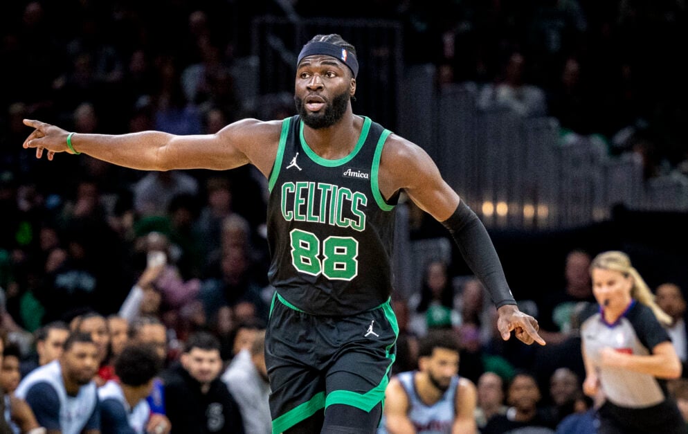 Boston Celtics' center Neemias Queta adjusts the team's defense in transition.