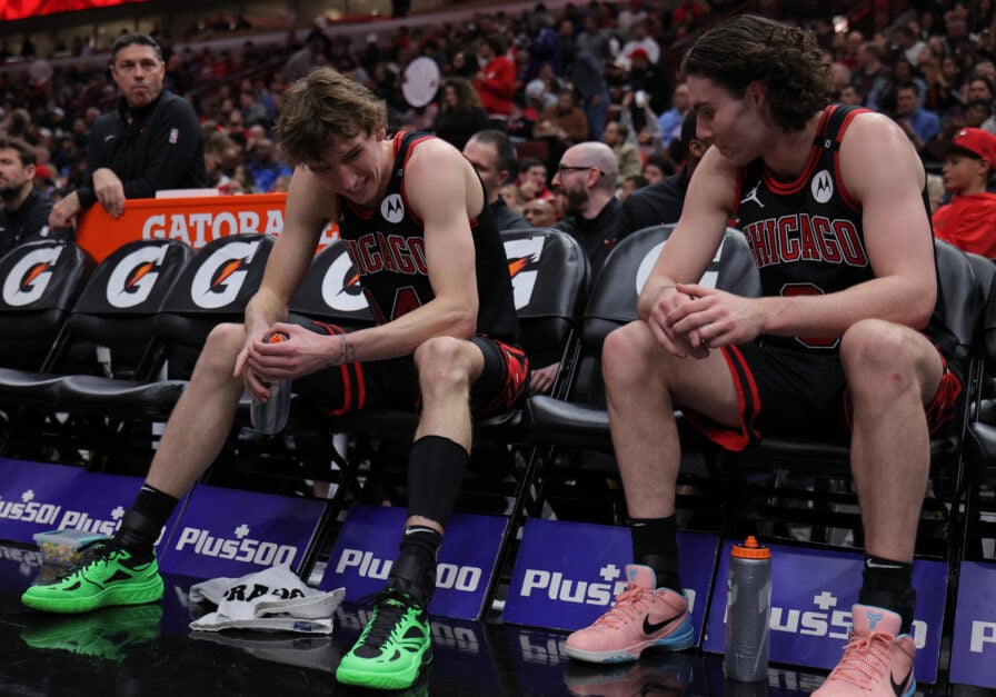 Josh Giddey #3 of the Chicago Bulls and Matas Buzelis #14 of the Chicago Bulls chat during the second half against the Miami Heat on April 9, 2025 at the United Center in Chicago, Illinois.