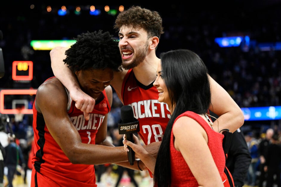 Alperen Sengun and Amen Thompson celebrate after the Houston Rockets win a playoff game