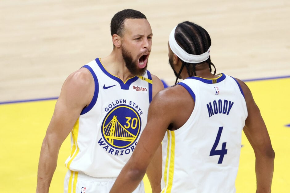 Golden State Warriors' Stephen Curry celebrates a Moses Moody dunk against Memphis Grizzlies.