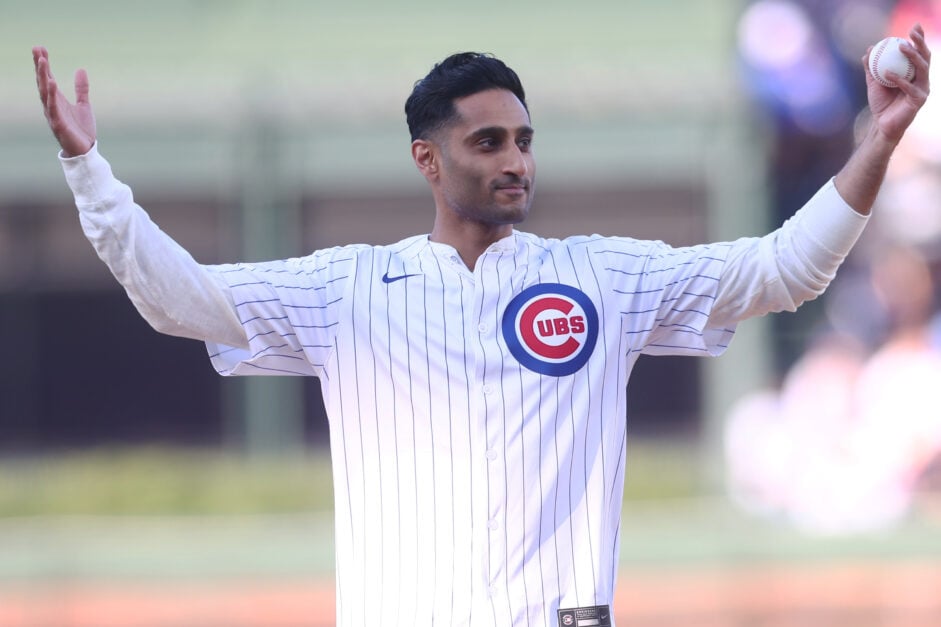 NBA insider Shams Charania prepares to throw out the ceremonial first pitch before a game between the Chicago Cubs and the Philadelphia Phillies at Wrigley Field.